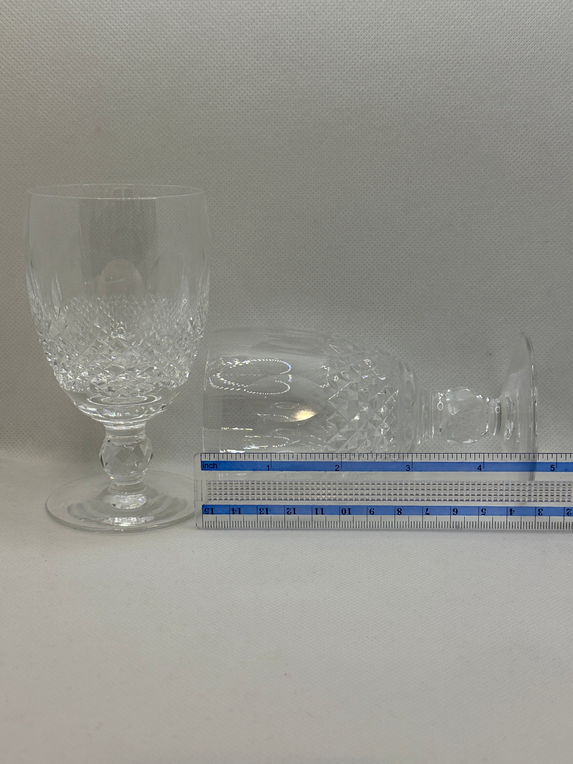 Two clear glass goblets with intricate designs.