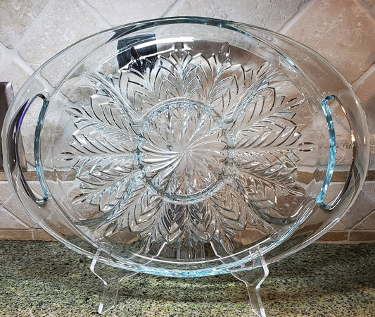 Decorative glass plate with floral design on a countertop
