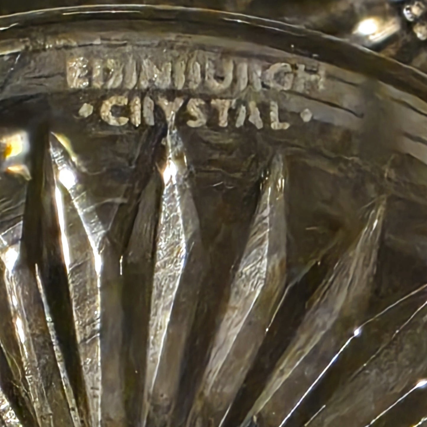 Close-up of Edinburgh Crystal glass with engraved text