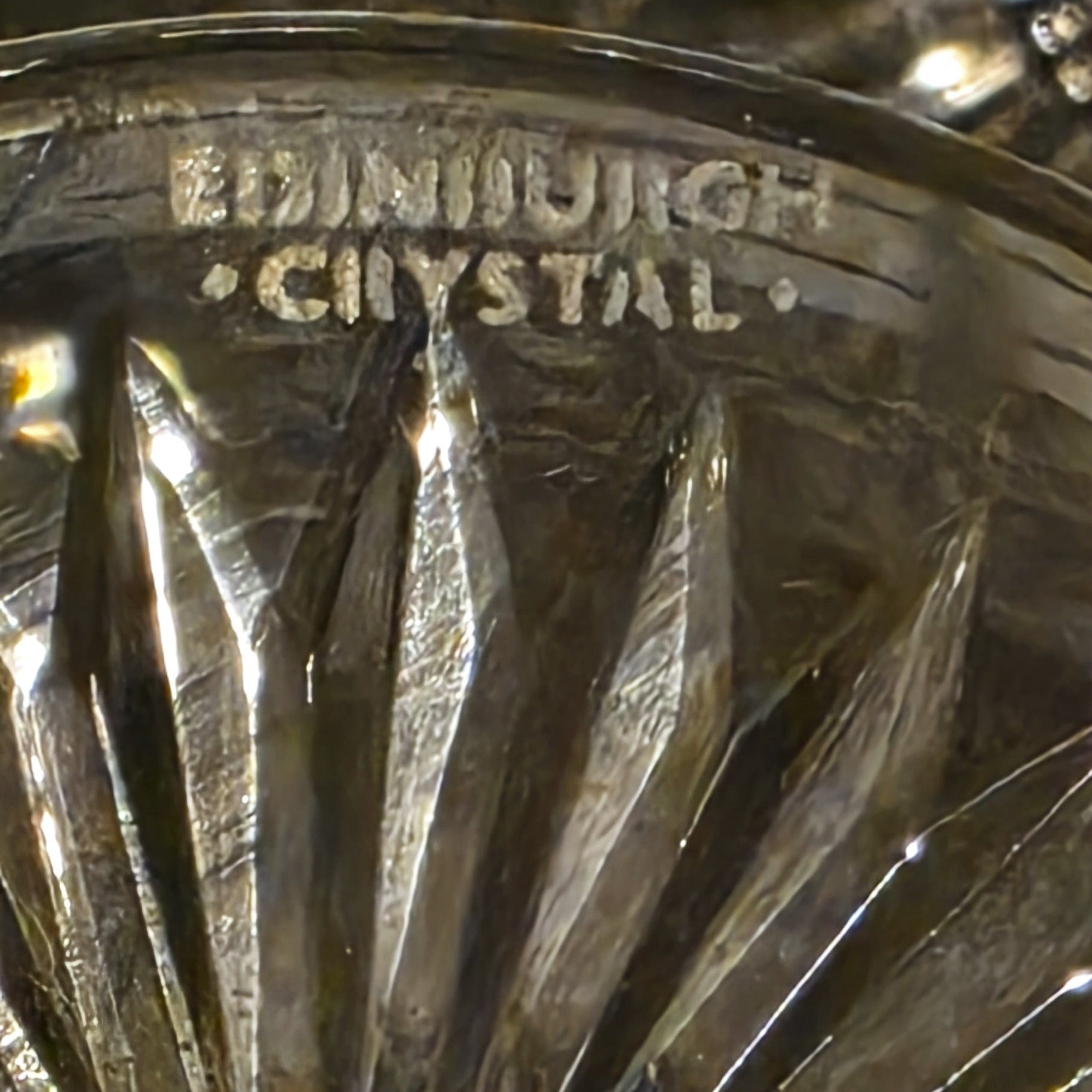 Close-up of Edinburgh Crystal glass with engraved text